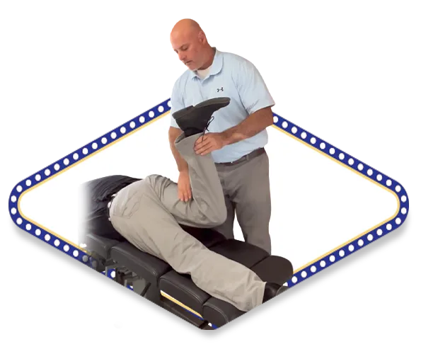 Dr. Dale Kimberlin conducting muscle resistance testing for sports injury assessment and recovery at Kimberlin Chiropractic Health Systems in Ankeny Iowa.