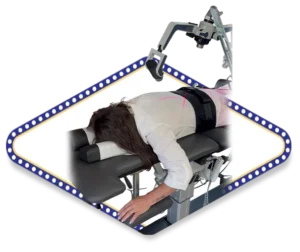 A patient receiving non-surgical laser therapy on a specialized chiropractic table with a mechanical traction device, framed by a diamond-shaped border with blue lights.