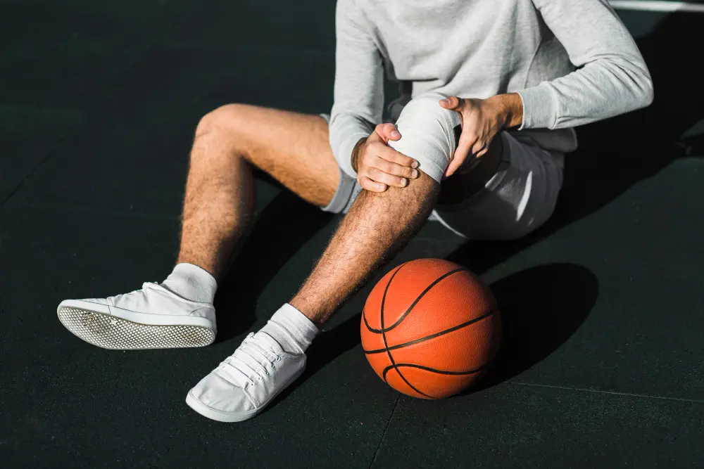 male athlete experiencing sports injury during activity