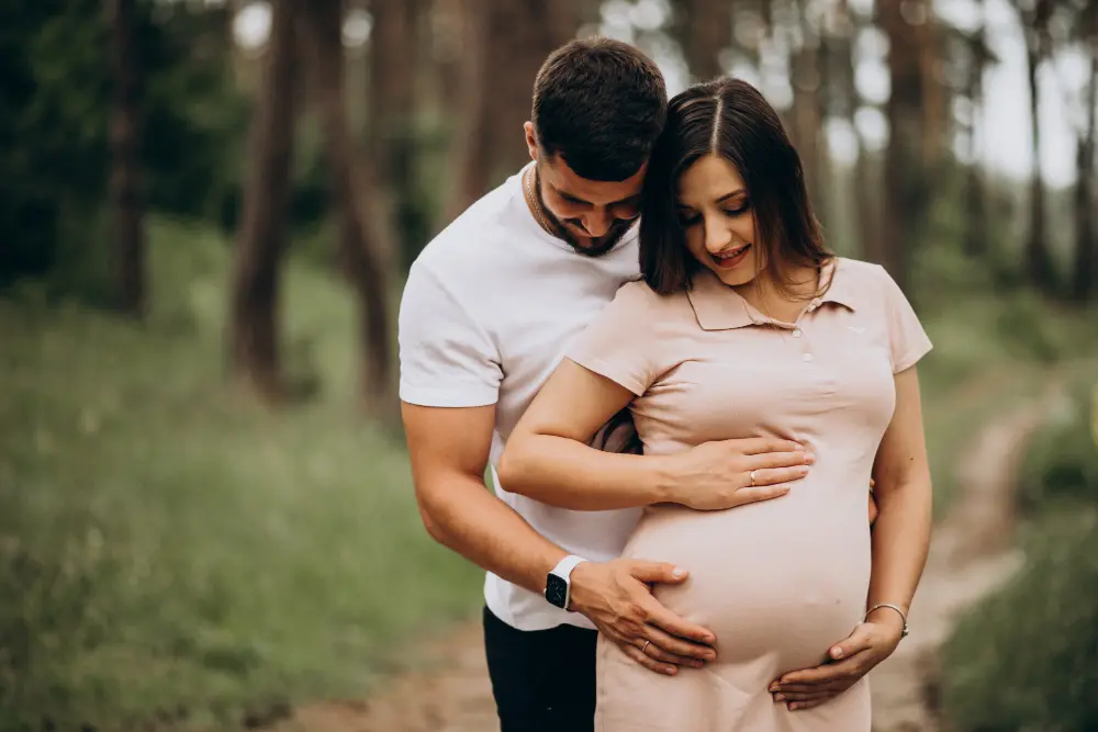 expecting couple standing outdoors during healthy pregnancy journey