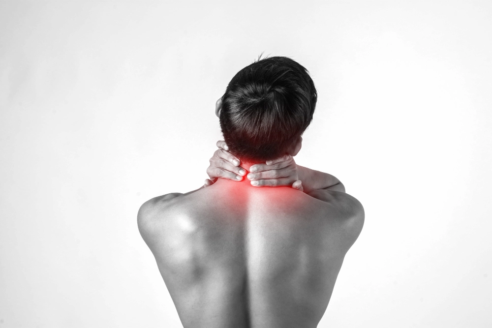 Person waking up with neck pain after sleeping in poor position