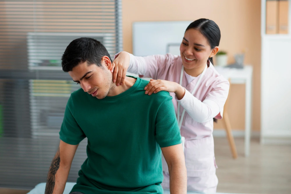 Person experiencing pinched nerve pain in neck and lower back