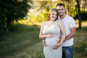 Pregnant woman experiencing sciatica pain in lower back and leg